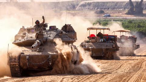 Israeli tanks move near the border with the Gaza Strip on May 13, 2024. (Photo by Jack Guez/AFP via Getty Images)