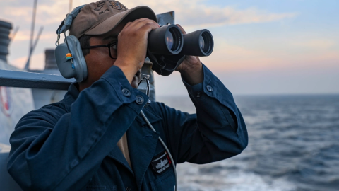 Seaman standing lookout watch on the bridge wing of the guided-missile destroyer USS Higgins (DDG 76) as the ship conducts routine Taiwan Strait transit. (Mass Communication Specialist 1st Class Donavan K. Patubo via DVIDS)
