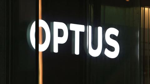 An illuminated sign is displayed in the window of an outlet for the Australian communications company Optus in Sydney on November 9, 2023. Australia's government on November 9 launched an investigation into a nationwide communications outage that crippled phone lines and severed internet access for 10 million customers countrywide. (Photo by DAVID GRAY / AFP) (Photo by DAVID GRAY/AFP via Getty Images)