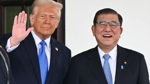 US President Donald Trump waves as he greets Japanese Prime Minister Shigeru Ishiba upon arrival outside the West Wing of the White House in Washington, DC, on February 7, 2025. (Mandel Ngan via Getty Images)