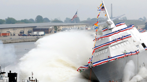 The nation’s first Littoral Combat Ship, Freedom, makes a side launch during her christening at the Marine shipyard in Marinette, Wis., Sept. 23, 2006. (Lockheed Martin)