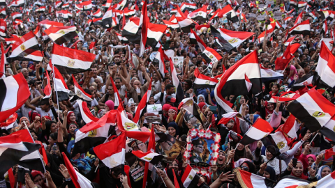 Egyptians wave national flags in Cairo's Tahrir Square on June 3, 2014 after ex-army chief Abdel Fattah al-Sisi won Egypt's presidential election. (MOHAMED EL-SHAHED/AFP/Getty Images)