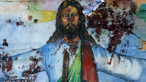 A blood-stained image of Jesus Christ outside the Al-Qiddissine (The Saints) church after an overnight car bomb attack in Alexandria, January 1, 2011. (MOHAMMED ABED/AFP/Getty Images)