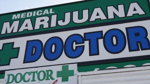 Signage hangs outside +Doctor, a medical marijuana evaluation clinic, on July 25, 2012 in Los Angeles, California. (David McNew/Getty Images)