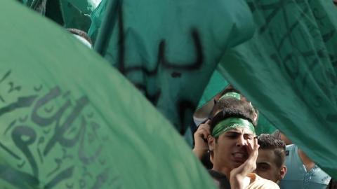 Palestinian supporters of Hamas shout anti-Israeli slogans during a demonstration in the West Bank city of Nablus on August 4, 2014. (JAAFAR ASHTIYEH/AFP/Getty Images)