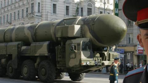 A Russian policeman guards in front of Topol-M ICBM in Moscow on May 5, 2008. (ALEXANDER NEMENOV/AFP/Getty Images)