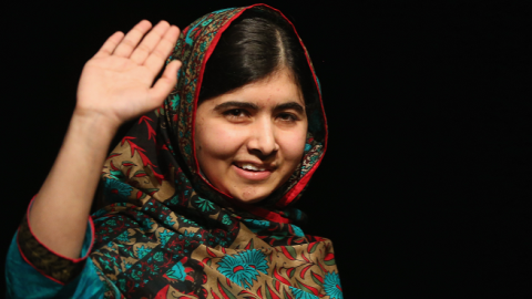 Malala Yousafzai waves to the crowd at a press conference at the Library of Birmingham after being announced as a recipient of the Nobel Peace Prize, on October 10, 2014 in Birmingham, England. (Christopher Furlong/Getty Images)