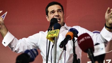 Syriza leader Alexis Tsipras celebrates after his party's victory in the Greek general elections at his campaign headquarters in Athens, September 20, 2015. (LOUISA GOULIAMAKI/AFP/Getty Images)