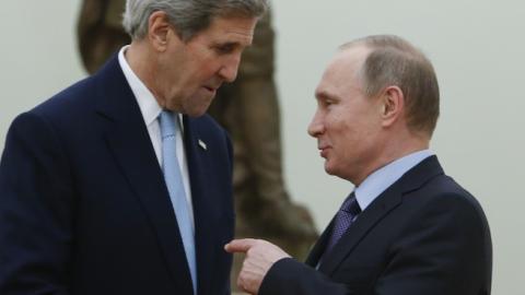 Russian President Vladimir Putin (R) speaks with US Secretary of State John Kerry during a meeting at the Kremlin in Moscow on December 15, 2015. (SERGEI KARPUKHIN/AFP/Getty Images)