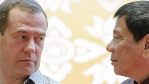 Russian Prime Minister Dmitry Medvedev (L) chats with Philippine President Rodrigo Duterte at the Association of Southeast Asian Nations (ASEAN) Summit in Vientiane on September 7, 2016. (YE AUNG THU/AFP/Getty Images)