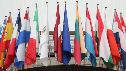 Flags of the European Union member states hang inside the Council of the European Union's Lex building on February 18, 2016 in Brussels, Belgium. (Dan Kitwood/Getty Images)