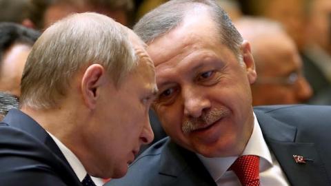 Turkish President Recep Tayyip Erdogan (R) speaks with Russian President Vladimir Putin (L) prior to a joint press conference at Turkey's Presidential Palace in Ankara, Turkey on December 01, 2014. (Kayhan Ozer/Anadolu Agency/Getty Images)
