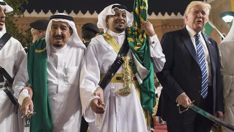 Saudi Arabia's King Salman bin Abdulaziz Al Saud and U.S. President Donald Trump join dancers with swords at Murabba Palace in Riyadh, Saudi Arabia, May 20, 2017 (Bandar Algaloud / Saudi Royal Council / Handout/Anadolu Agency/Getty Images)