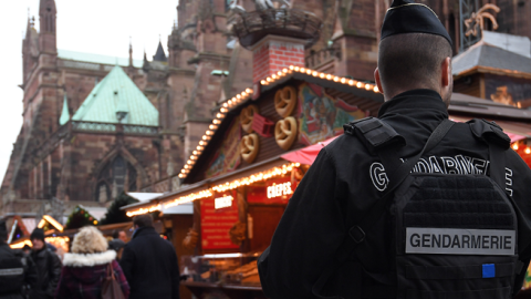 An armed gendarme stands guard at Strasbourg's Christmas market, on its reopening day, on December 14, 2018, one day after French police shot dead the gunman who killed three people there. (PATRICK HERTZOG/AFP/Getty Images)