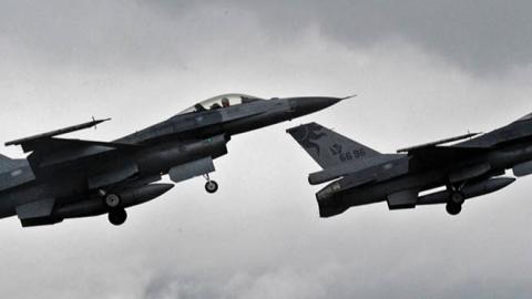 Two US-made F-16 fighters in the air during an scramble take off at the eastern Hualien air force base on January 23, 2013. The Taiwan air force demonstrated their combat skills at the Hualien air base during an annual training before the coming lunar new