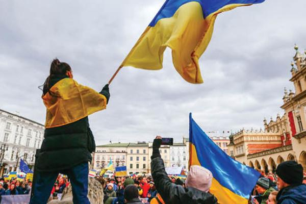 A protester is seen waving a Ukrainian flag during a demonstration in Krakow, Poland on February 27, 2022. (Getty Images)