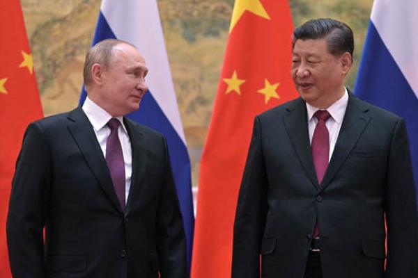 Russian President Vladimir Putin and Chinese President Xi Jinping pose during their meeting in Beijing, on February 4, 2022. (Getty Images)