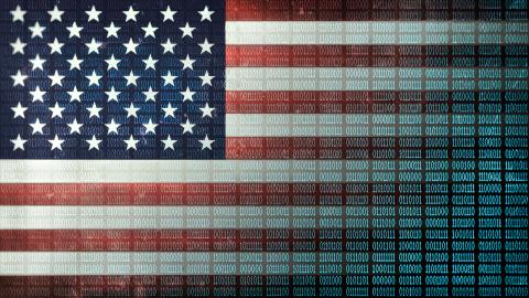 Binary code in a 1970 dot matrix font on a distressed US Flag faded to data. (Matt Anderson via Getty Images)