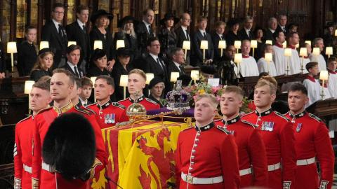 The coffin of Queen Elizabeth II is carried by Pall bearers from the Queen's Company at St George's Chapel, Windsor Castle, on September 19, 2022, in Windsor, England. (Jonathan Brady via Getty Images)