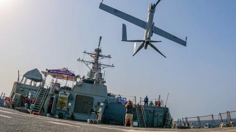 An Aerovel Flexrotor unmanned aerial vehicle lands on the flight deck of guided-missile destroyer USS Paul Hamilton in the Gulf of Oman on June 26, 2023. (Elliot Schaudt via DVIDS)