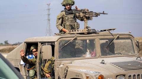 A convoy of Israel Defense Forces soldiers drives along a road near the outskirts of Netivot and near an Artillery position on October 11, 2023, in Netivot, Israel. (Alexi J. Rosenfeld via Getty Images)