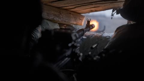 Ukrainian soldiers open fire from a large-caliber machine gun to suppress enemy shelling on November 3, 2023, in Bakhmut, Ukraine. (Kostya Liberov/Libkos via Getty Images)