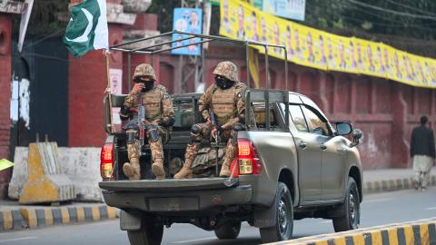 Military troops patrol near a polling station during Pakistan's national elections in Lahore on February 8, 2024. (Aamir Qureshi/AFP via Getty Images)