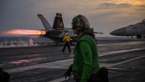 An F/A-18F Super Hornet fighter jet, attached to the "Fighting Swordsmen" of Strike Fighter Squadron 32, takes off from the flight deck aboard the Nimitz-class aircraft carrier USS Dwight D. Eisenhower (CVN 69) on July 10, 2023, in the Atlantic Ocean. (DVIDS)