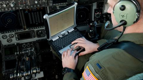 A C-17 pilot operates Mission Index Flying software on an Air Mobility Command mission laptop computer at Travis AFB on Feb. 15, 2012. (U.S. Air Force Photo/Ken Wright)