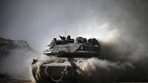 An Israeli tank moves along the border between the Gaza Strip and southern Israel on April 2, 2024. (Ronaldo Schemidt/AFP via Getty Images)