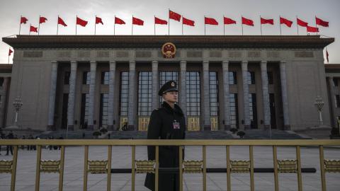A member of the Peoples Armed Police stands at the entrance of the National Peoples Congress at the Great Hall of the People on March 6, 2024 in Beijing, China. (Photo by Kevin Frayer/Getty Images)