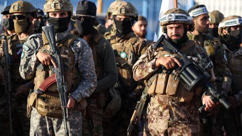 Military fighters affiliated with former Al-Qaeda affiliate Hayat Tahrir al-Sham attend prayer meeting in Idlib, Syria, on June 16, 2024. (Omar Haj Kadour/AFP via Getty Images)