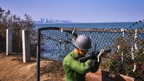 Figure of a Kuomintang soldier looking across at the Chinese city of Xiamen on February 4, 2021, in Lieyu, Taiwan. (An Rong Xu via Getty Images)