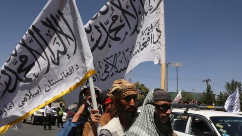 Afghan people holding flags in Kabul, Afghanistan, on August 15, 2023. (Bilal Guler/Anadolu Agency via Getty Images)