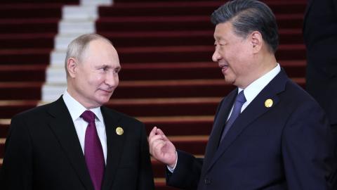 .Russian President Vladimir Putin and Chinese President Xi Jinping interacting in Beijing on October 17, 2023. (Sergei Savostyanov/POOL/AFP via Getty Images)