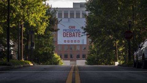 Banners are placed outside of CNN studios ahead of the first presidential debate in Atlanta, Georgia, on June 24, 2024. (Photo by Christian Monterossa/AFP via Getty Images)