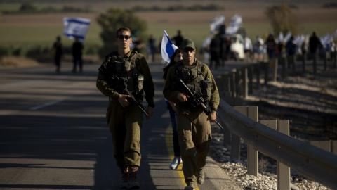 Israeli soldiers protect a march on July 17, 2024, in Kfar Azza, Israel. (Amir Levy via Getty Images)