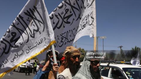 Afghan people holding flags celebrate on the 2nd anniversary of Taliban takeover in Kabul, Afghanistan on August 15, 2023. (Photo by Bilal Guler/Anadolu Agency via Getty Images)