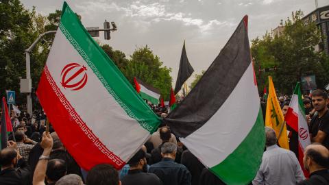 Iranians attend a funeral procession for late Hamas leader Ismail Haniyeh, in Tehran, the Capital of Iran on August 1, 2024. Hamas said its political leader was killed in an Israeli strike in Iran early on July 31, where he was attending the swearing-in of the new president. (Photo by Hossein Beris / Middle East Images / Middle East Images via AFP) (Photo by HOSSEIN BERIS/Middle East Images/AFP via Getty Images)