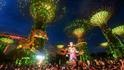 Visitors watch a show with at Gardens by the Bay in Singapore on February 7, 2024. (Roslan Rahman/AFP via Getty Images)