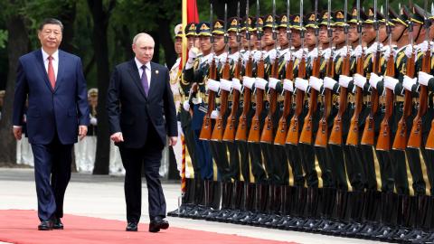 Russian President Vladimir Putin (R) is greeted by a ceremonial guard and received a red-carpet welcome in Beijing, China on May 16, 2024. Putin will pay a two-day official visit at the invitation of his Chinese counterpart Xi Jinping (L). (Kremlin Press Office / Handout/Anadolu via Getty Images)