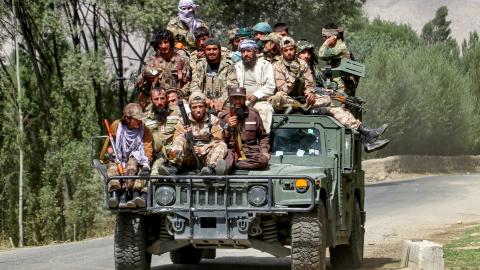 Armed Taliban security personnel sit atop a humvee armored vehicle, as they ride along a street in Khash district, Badakhshan province on September 1, 2024. (Photo by OMER ABRAR / AFP) (Photo by OMER ABRAR/AFP via Getty Images)