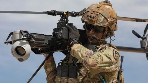 US Army Staff Sgt. Stetson Manuel carries the Ghost-X Unmanned Aircraft System on March 11, 2024, at Fort Irwin, California. (DVIDS)