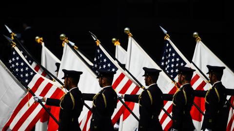 Soldiers hold US and Japanese flags during a welcome ceremony for US President Donald Trump and First Lady Melania Trump at the Imperial Palace in Tokyo on May 27, 2019. (Photo by Brendan SMIALOWSKI / AFP) (Photo credit should read BRENDAN SMIALOWSKI/AFP via Getty Images)