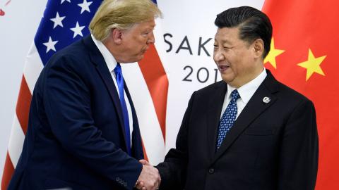 On June 28, 2019, Xi Jinping shakes hands with Donald Trump before a bilateral meeting at the G20 Summit in Osaka. (Brendan Smialowski/AFP via Getty Images)