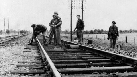 French Resistance fighters sabotaging a railway in Saône-et-Loire in September 1944. (Roger Viollet via Getty Images)