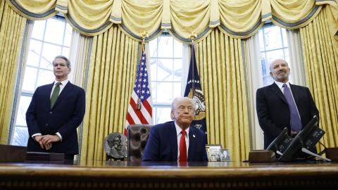 US Secretary of Treasury Scott Bessent and Howard Lutnick, US President Donald Trump's nominee for commerce secretary, stand behind him as he speaks to reporters in the Oval Office of the White House on February 3, 2025, in Washington, DC. (Anna Moneymaker/Getty Images)