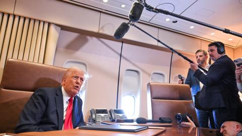 US President Donald Trump speaks to the press aboard Air Force One enroute to New Orleans, Louisiana, on Febrary 9, 2025. (ROBERTO SCHMIDT/AFP via Getty Images)