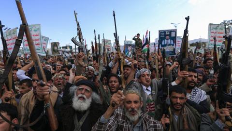 Yemenis brandish rifles and chant during a demonstration called for by the rebel Houthi movement in Sanaa on March 17, 2025. (Mohammed Huwais / AFP via Getty Images)