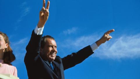 Richard Nixon gives his well-known two-armed victory salute during a campaign stop in El Paso. (Getty Images)